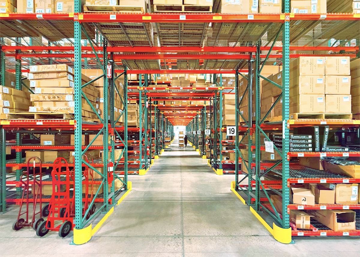 A modern warehouse aisle with organized shelving