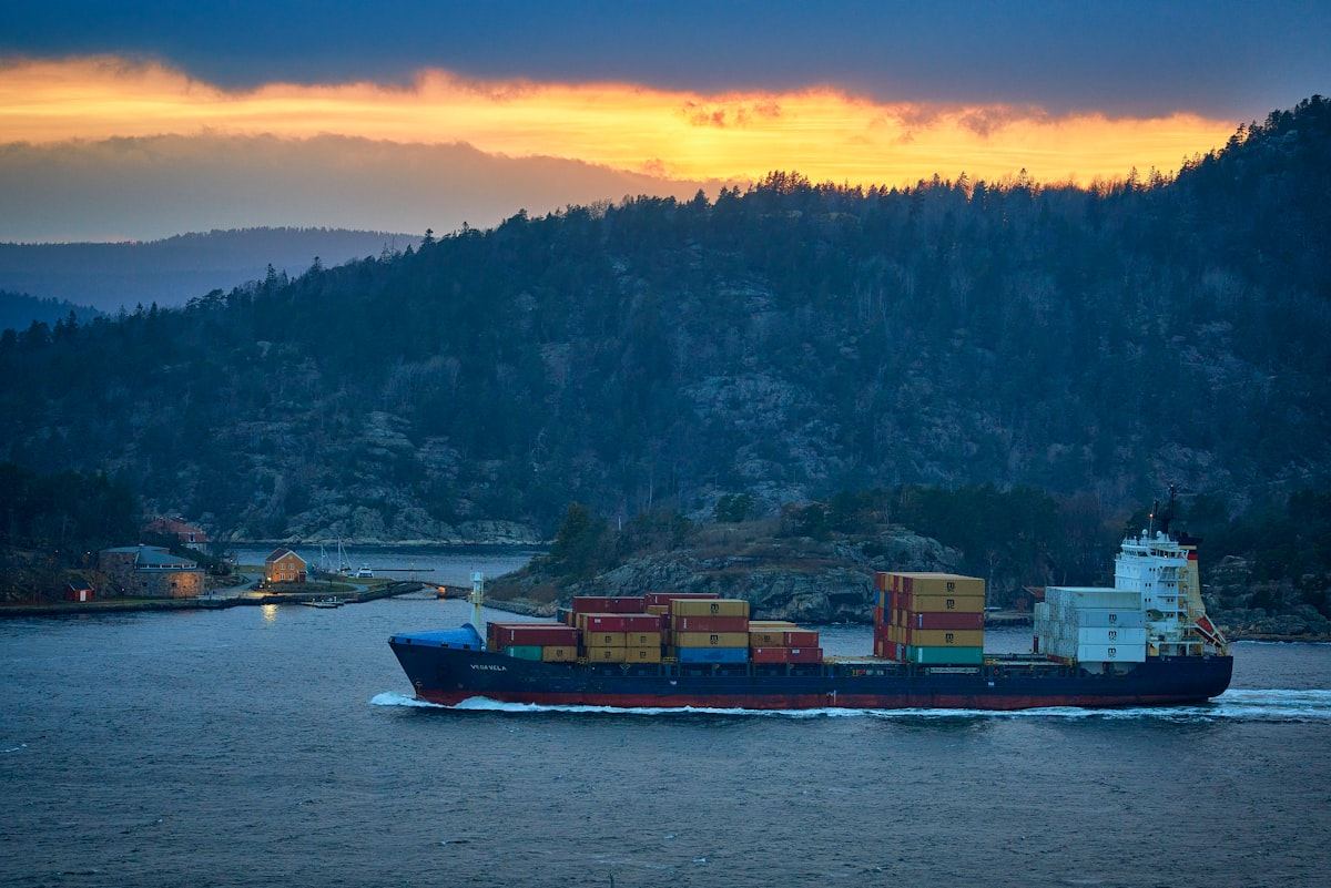 A container ship at sea during golden hour